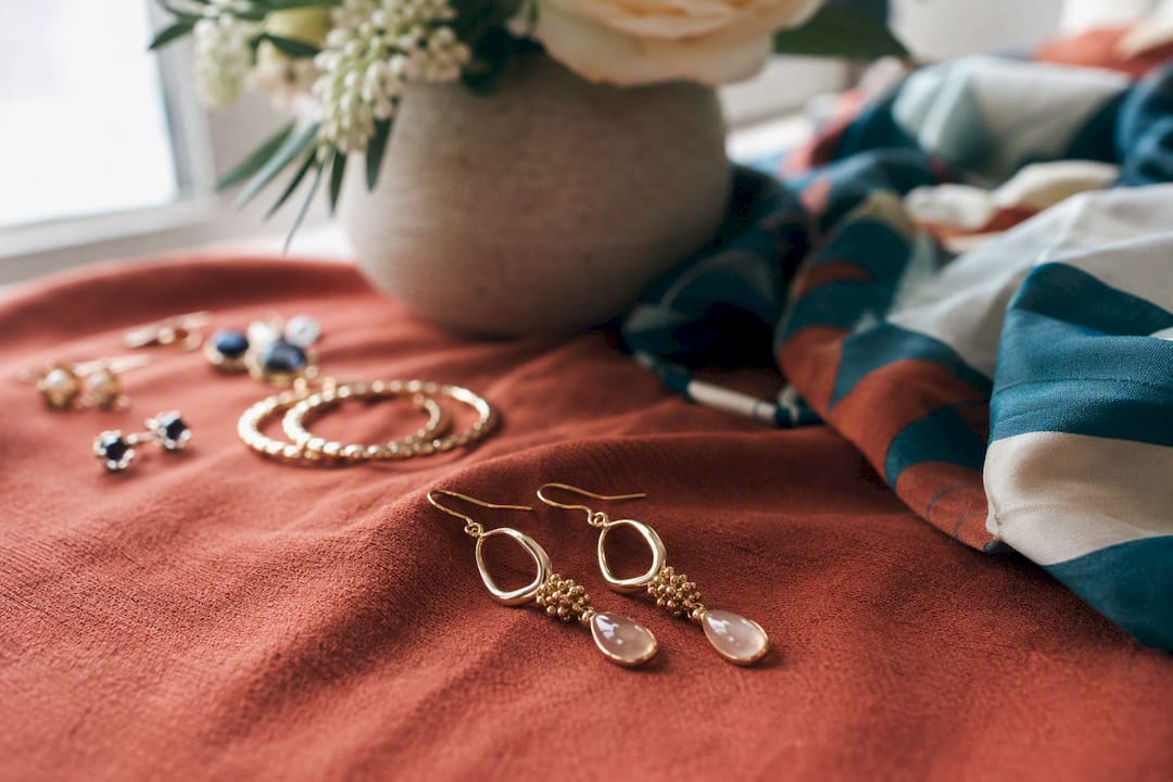 Close-up of elegant earrings on fabric