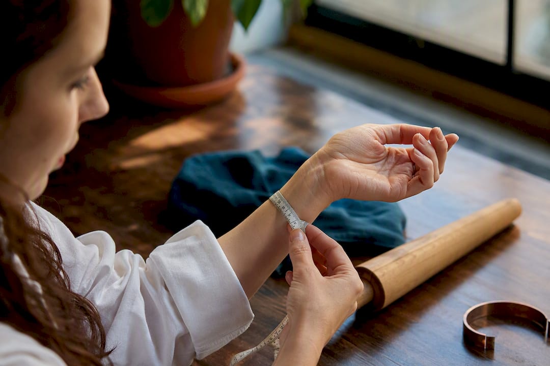 Close-up of wrist being measured for bracelet fit